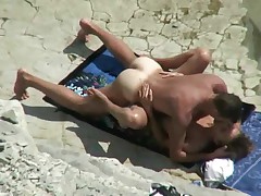 Couple spyed on a beach