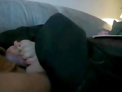 Dude Gets A Nice Footjob On The Couch