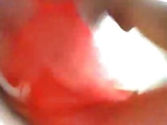 Busty Ebony Babe In Red Fishnet Catsuit Teasing