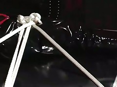 Helpless Fetish Babe Tied Down In PVC