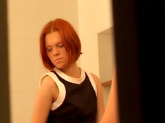 Redhead Emily masturbating in the bathroom
