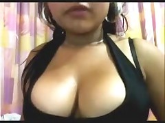 Argentinean amateur slut shows her big dark tits on cam