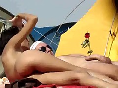 Teasing on a nudist beach