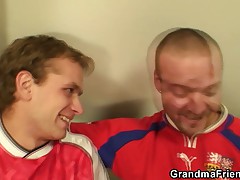Two football fans bang old bitch