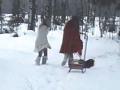 Two teen girls playing in the snow