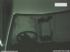Inside Of Dark Car, A Man Was Over A Woman On The Seat